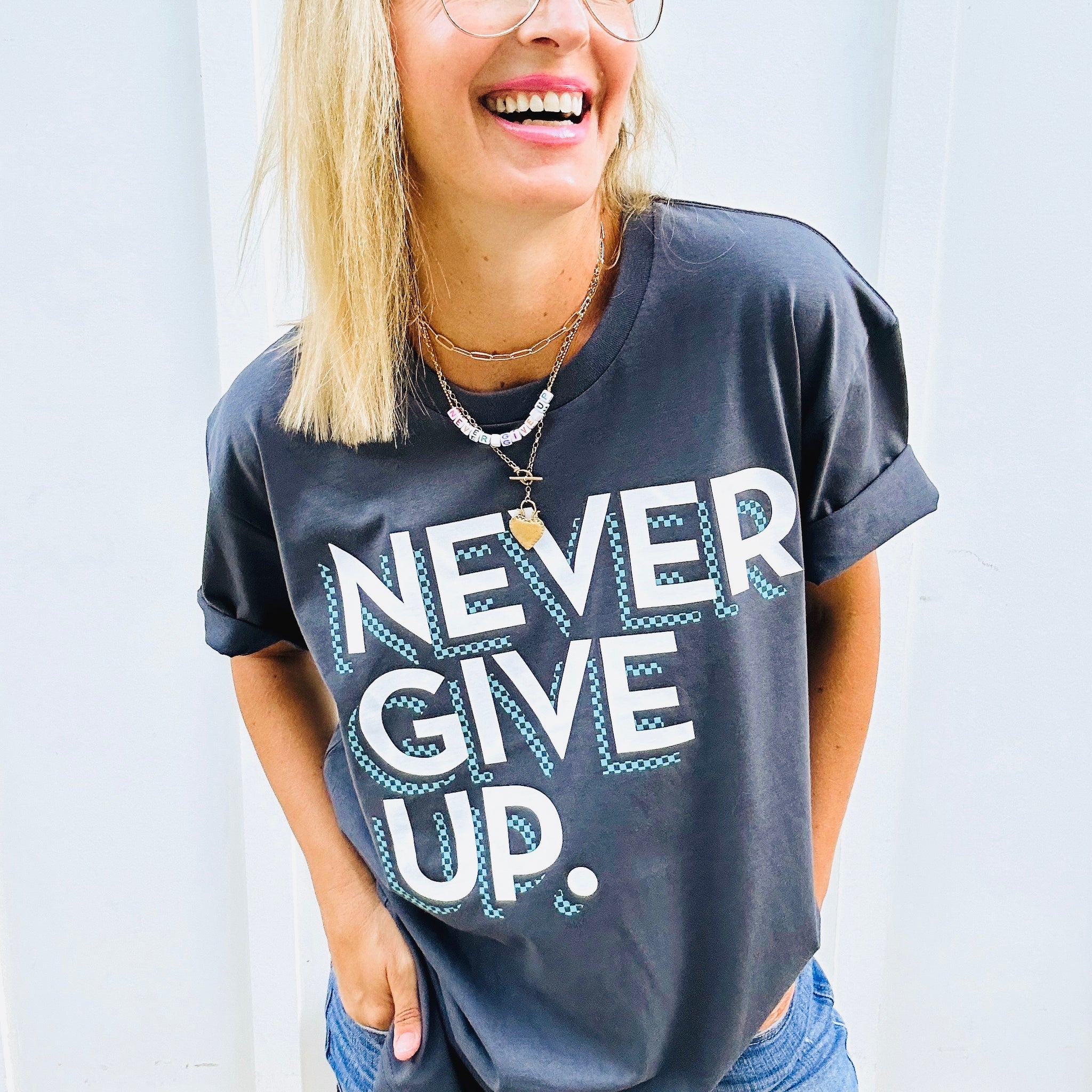 CHECKERBOARD NEVER GIVE UP. TEE