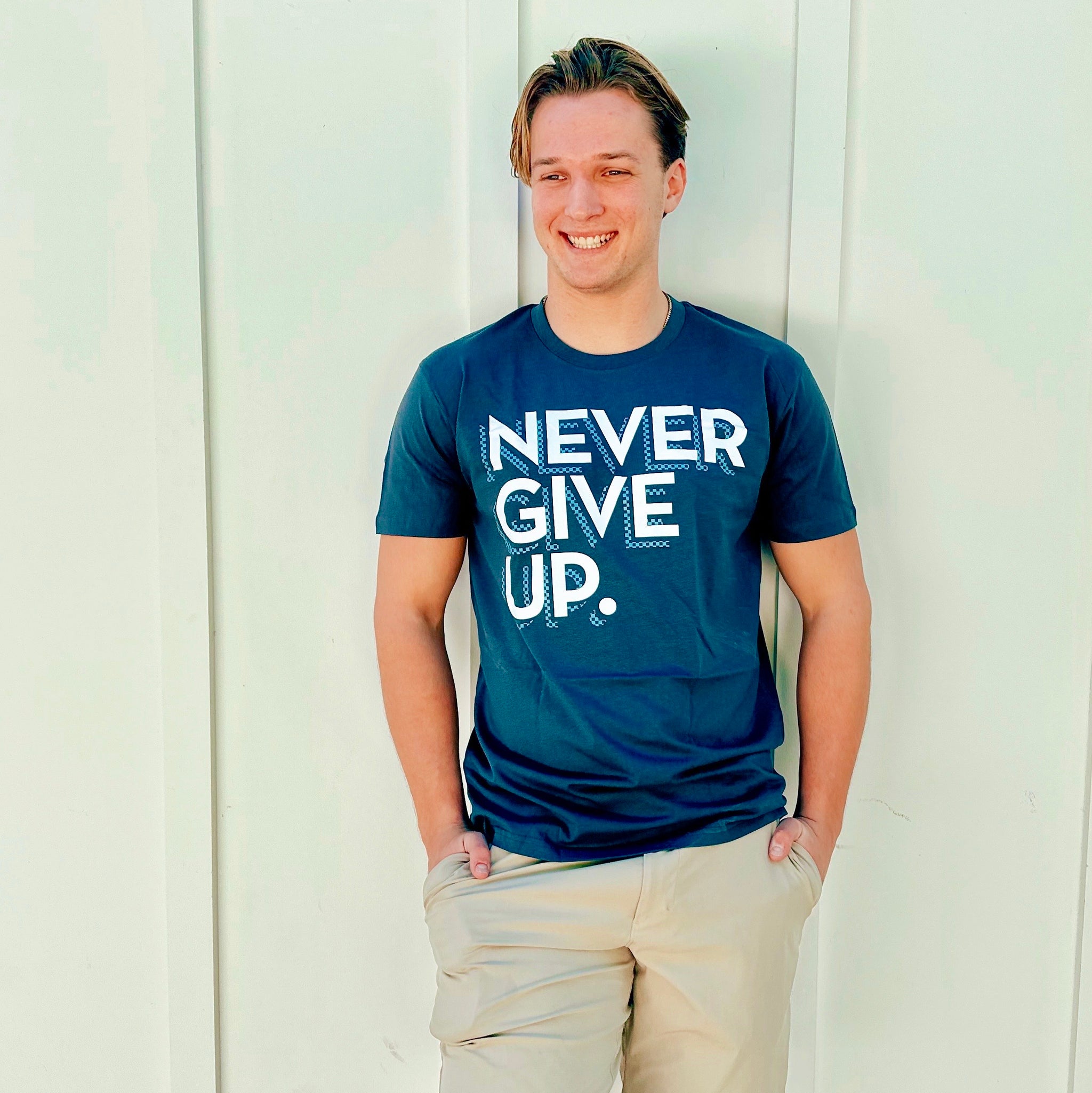 CHECKERBOARD NEVER GIVE UP. TEE