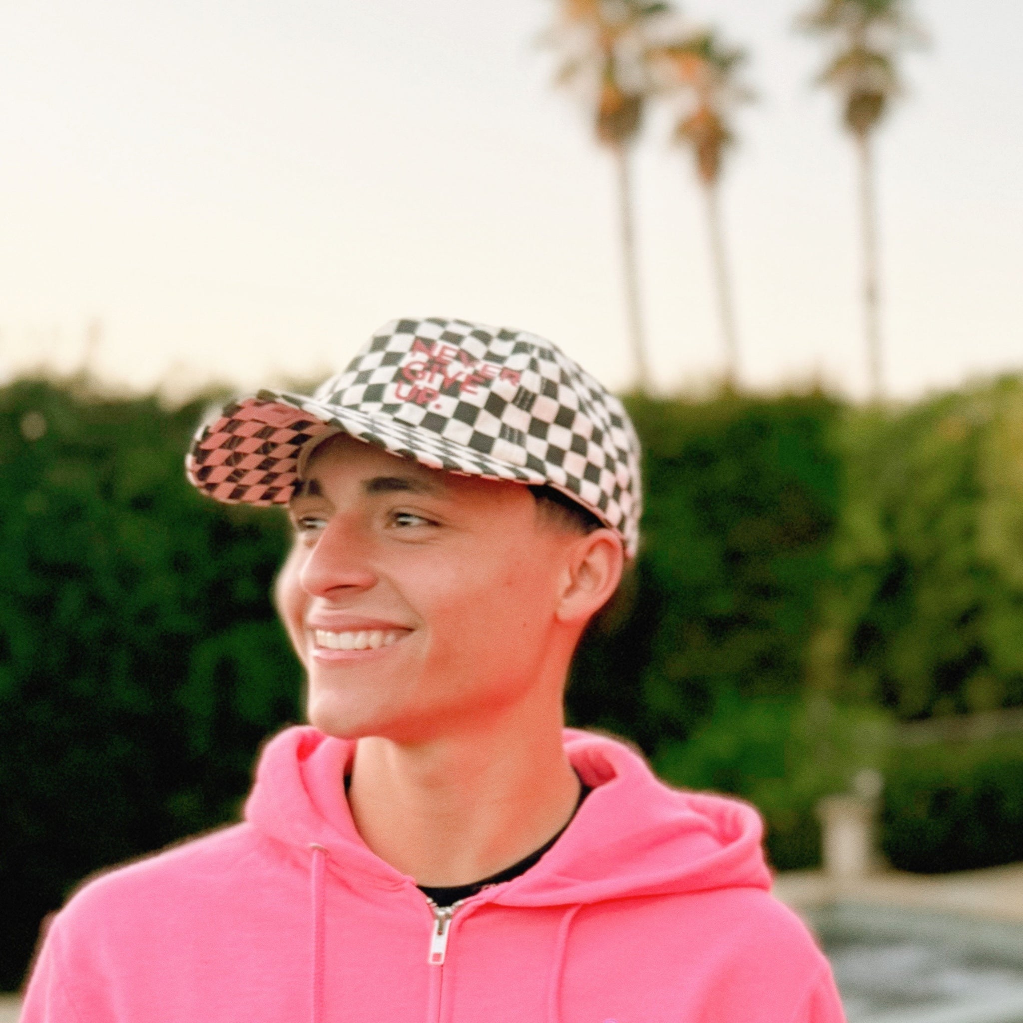 NEVER GIVE UP. BLACK CHECKERED HAT