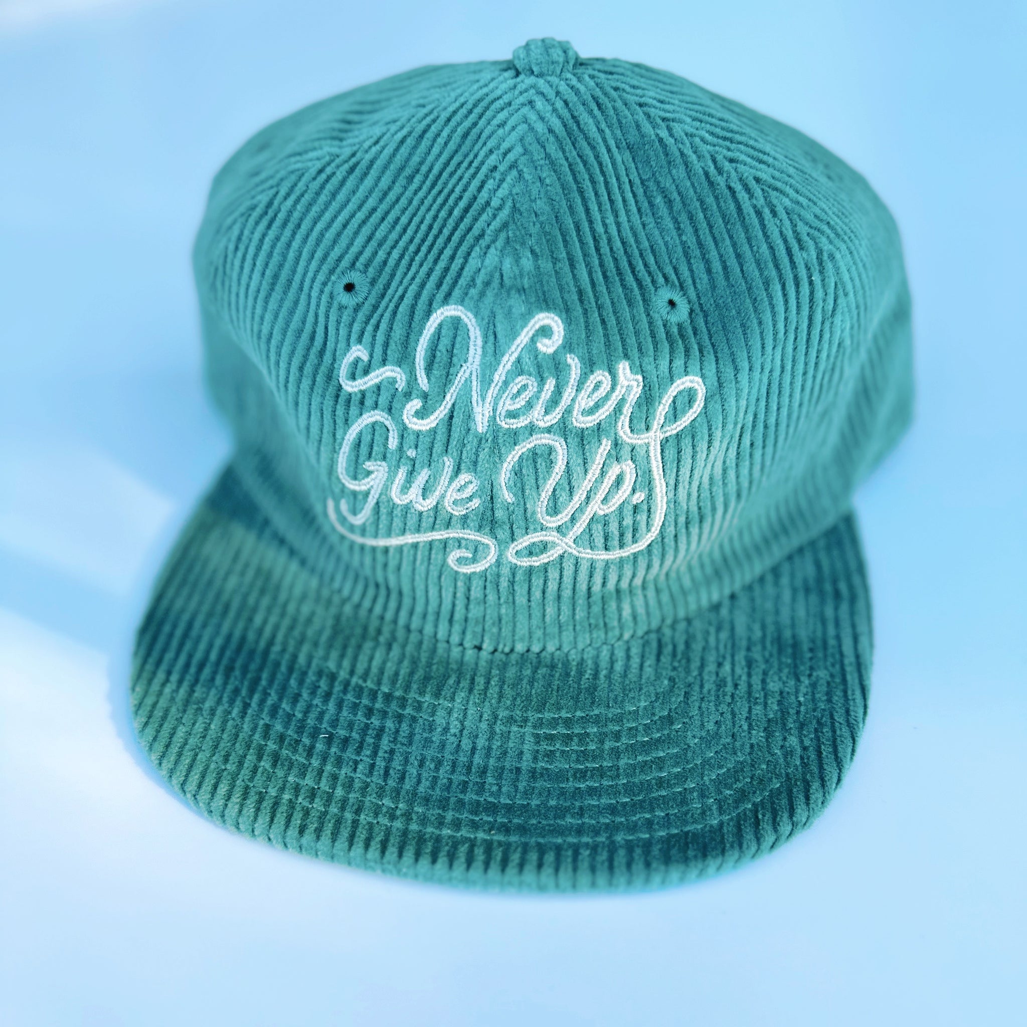 NEVER GIVE UP. CORD HAT
