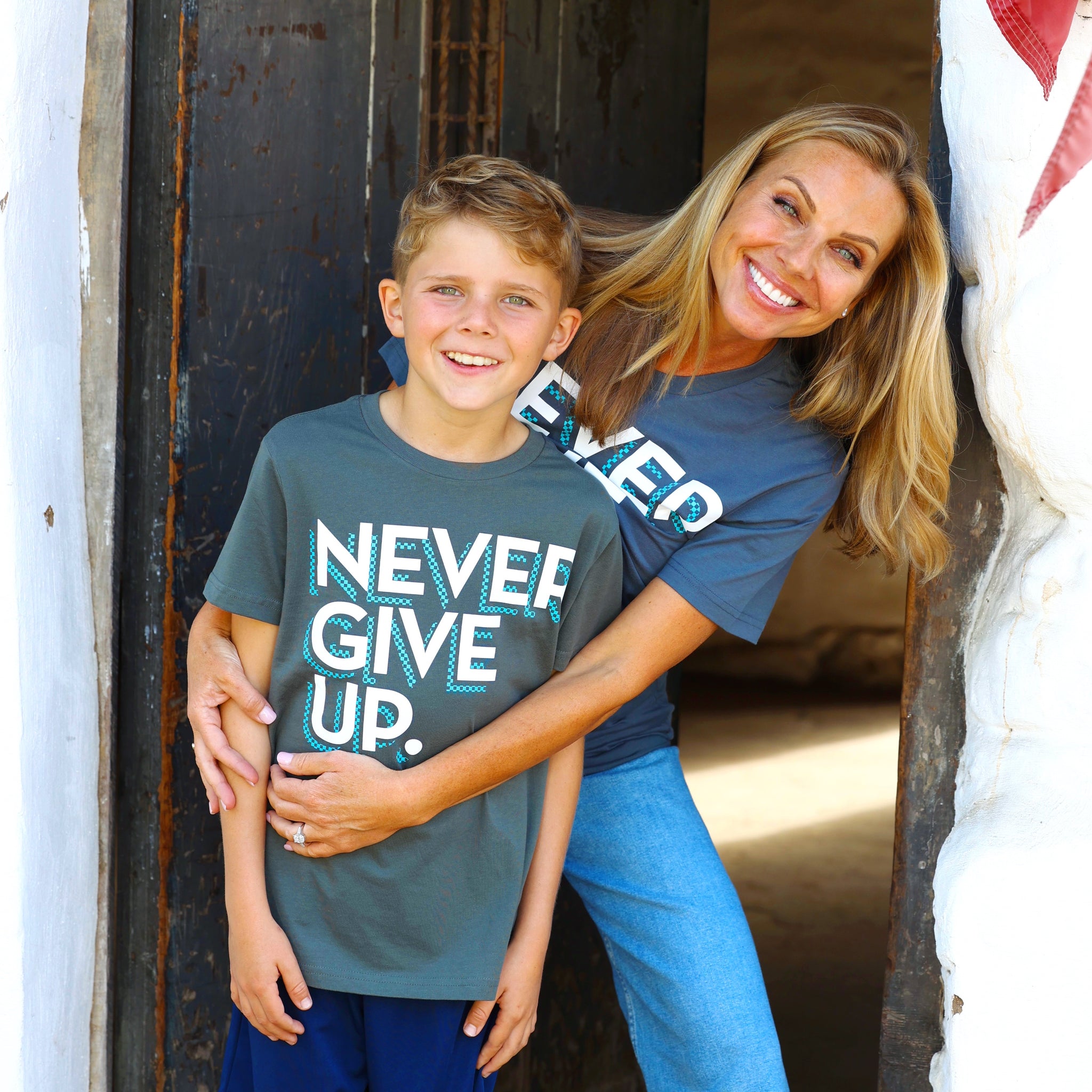 CHECKERBOARD NEVER GIVE UP. TEE