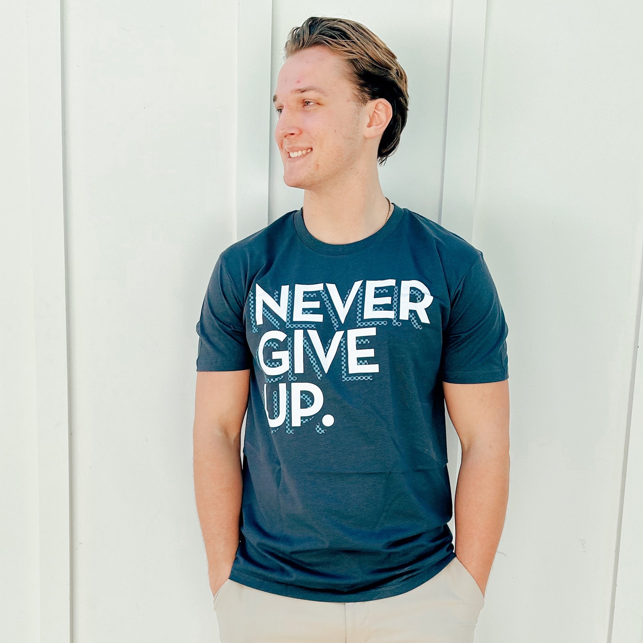CHECKERBOARD NEVER GIVE UP. TEE