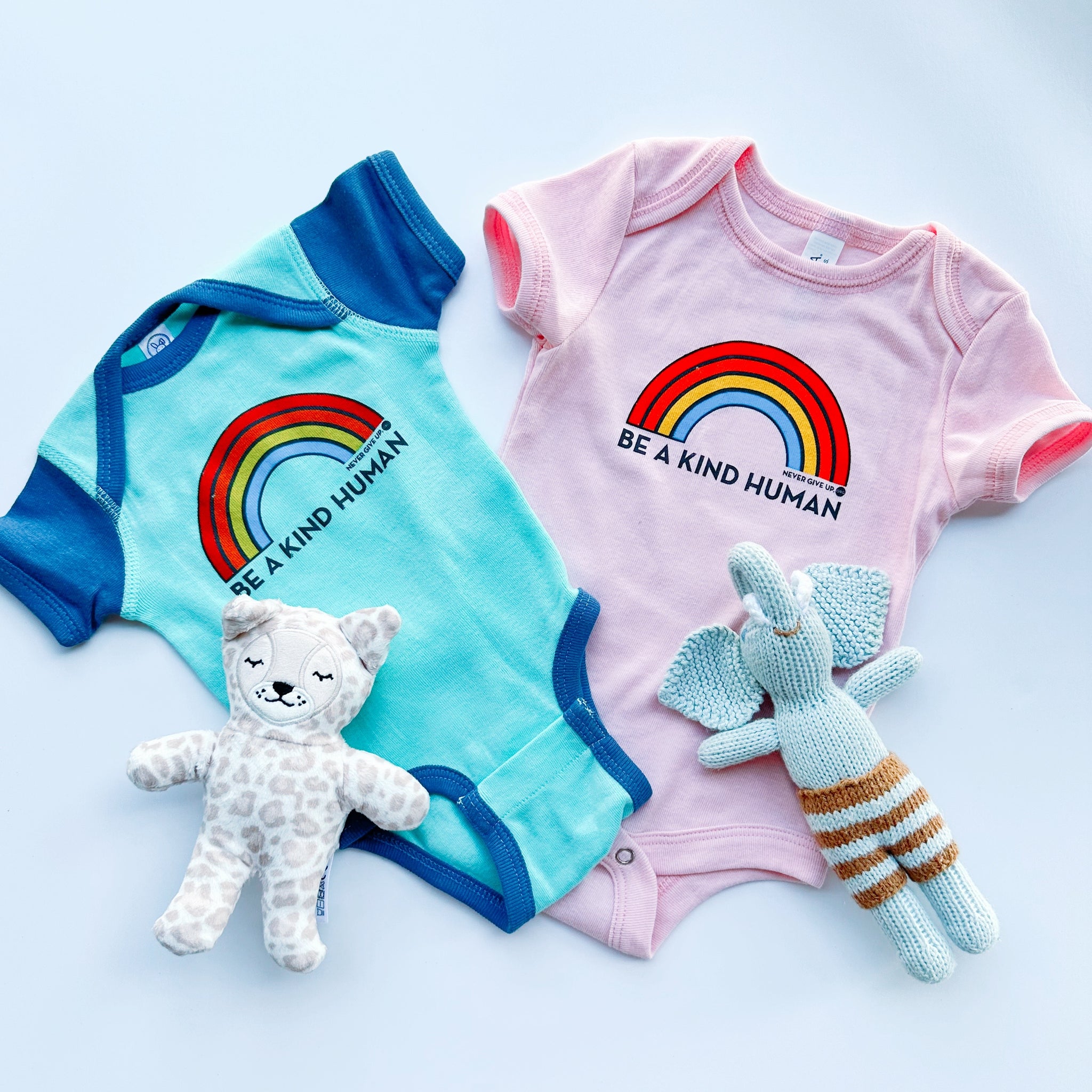 BE A KIND HUMAN BRIGHT RAINBOW ONESIE