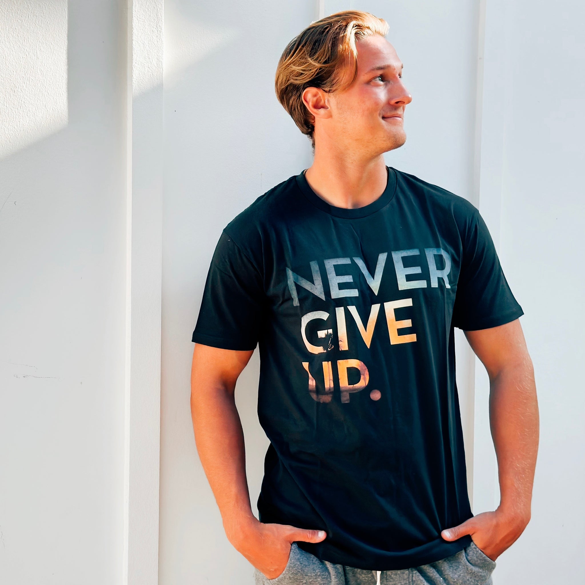 SUNSET NEVER GIVE UP. TEE