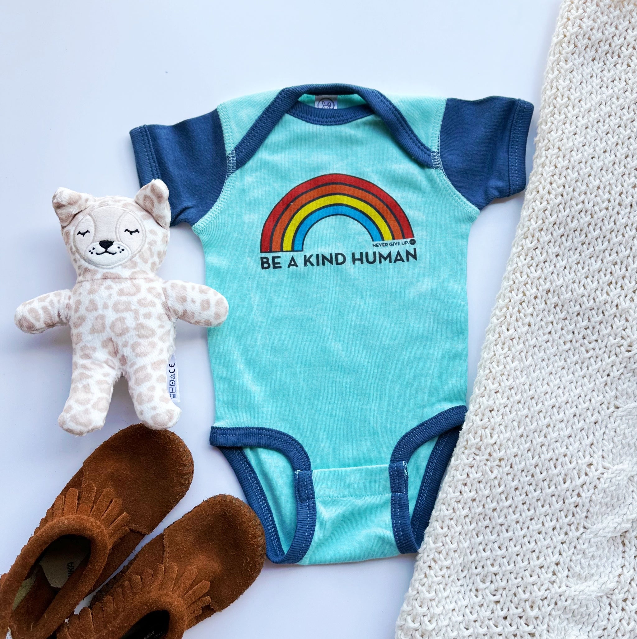 BE A KIND HUMAN BRIGHT RAINBOW ONESIE