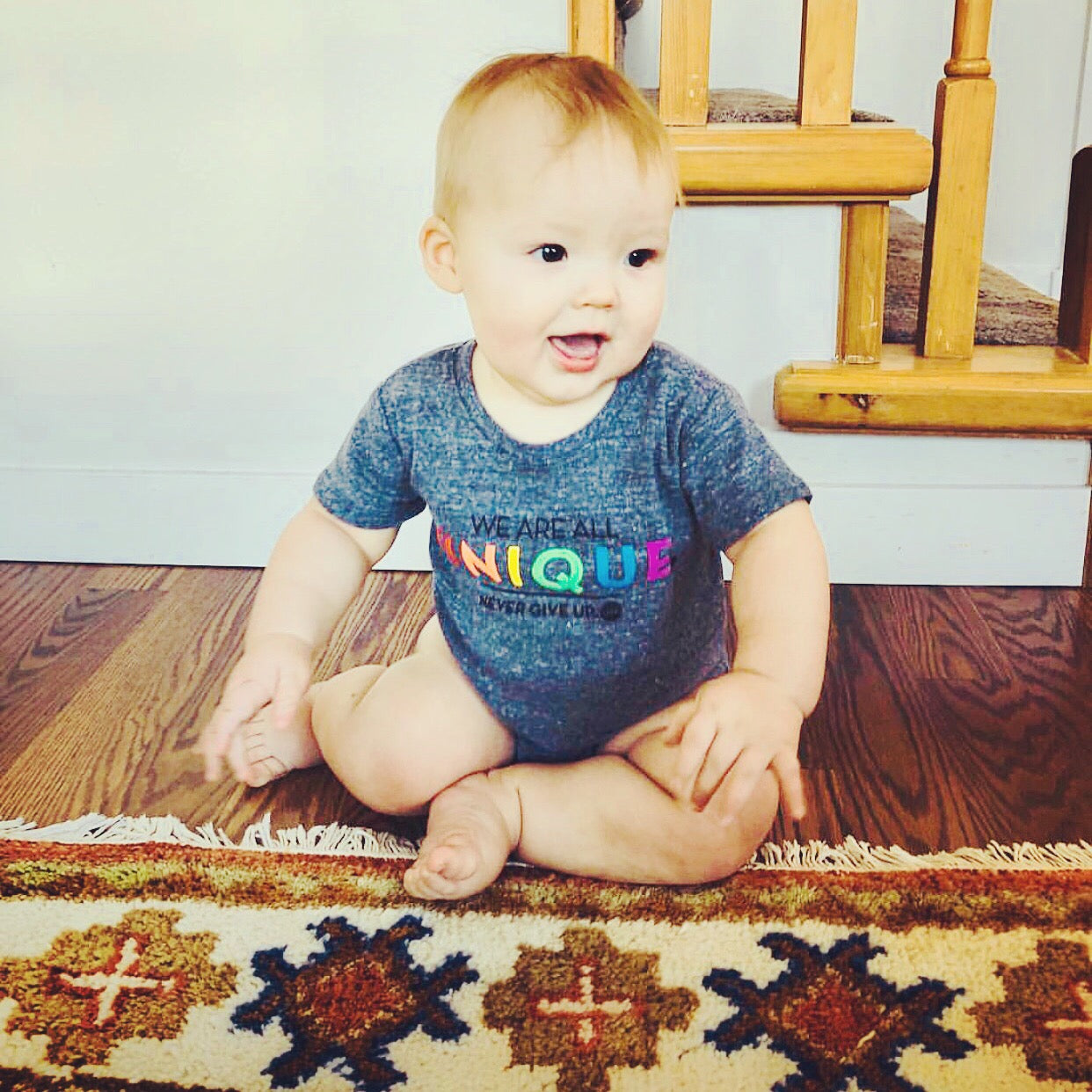 BABY WE ARE ALL UNIQUE ONESIE