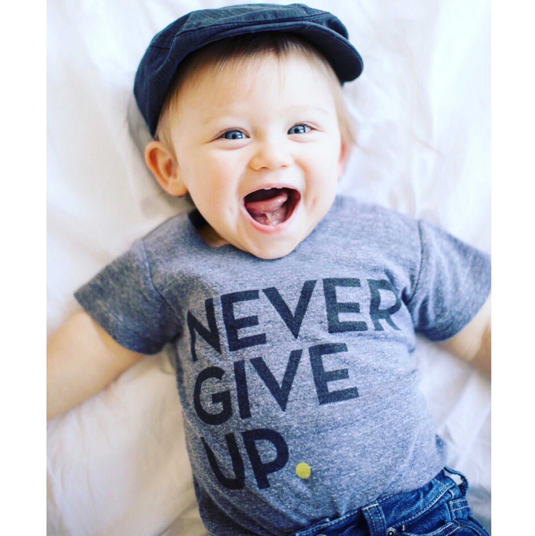 BABY NEVER GIVE UP. ONESIE