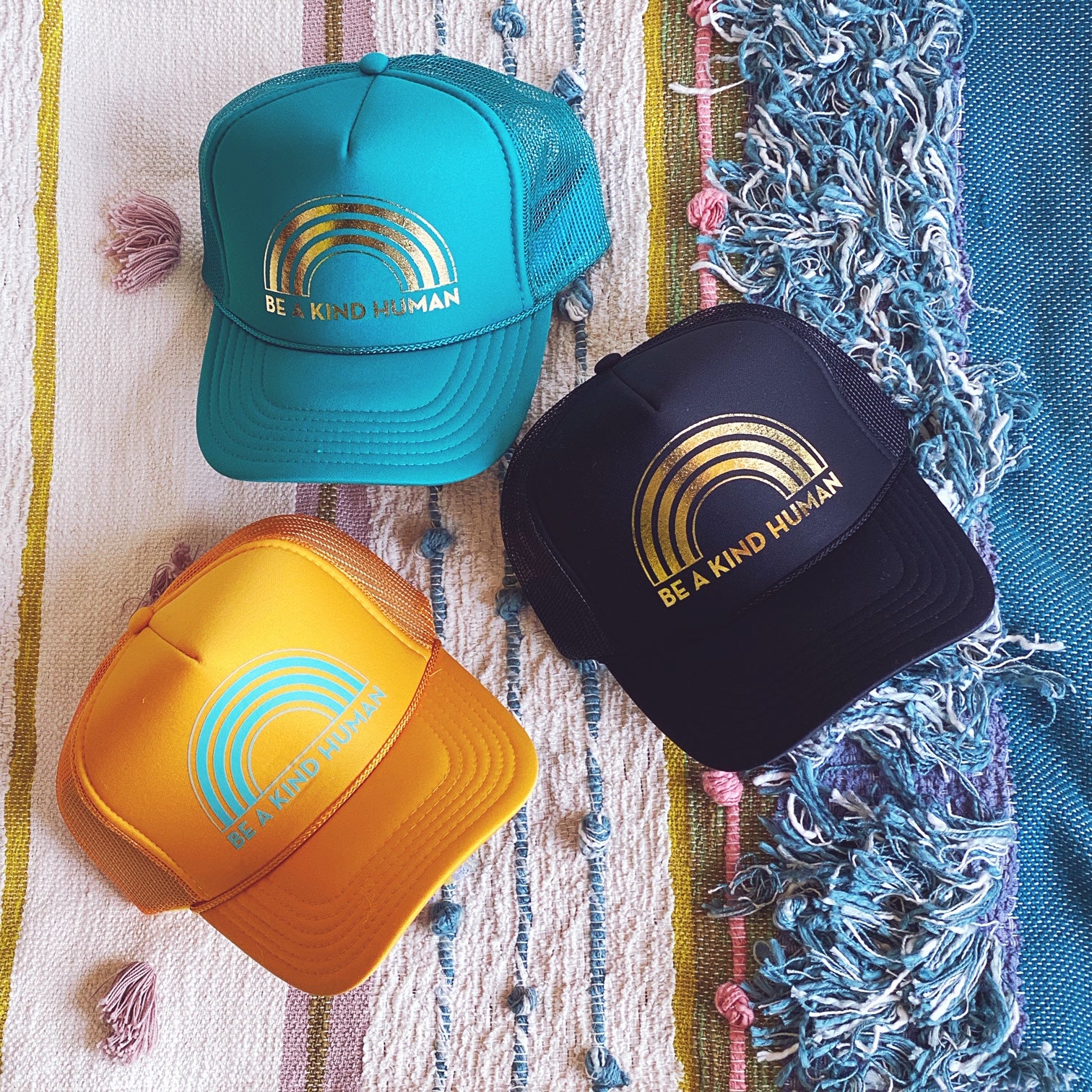 BE A KIND HUMAN TRUCKER HAT
