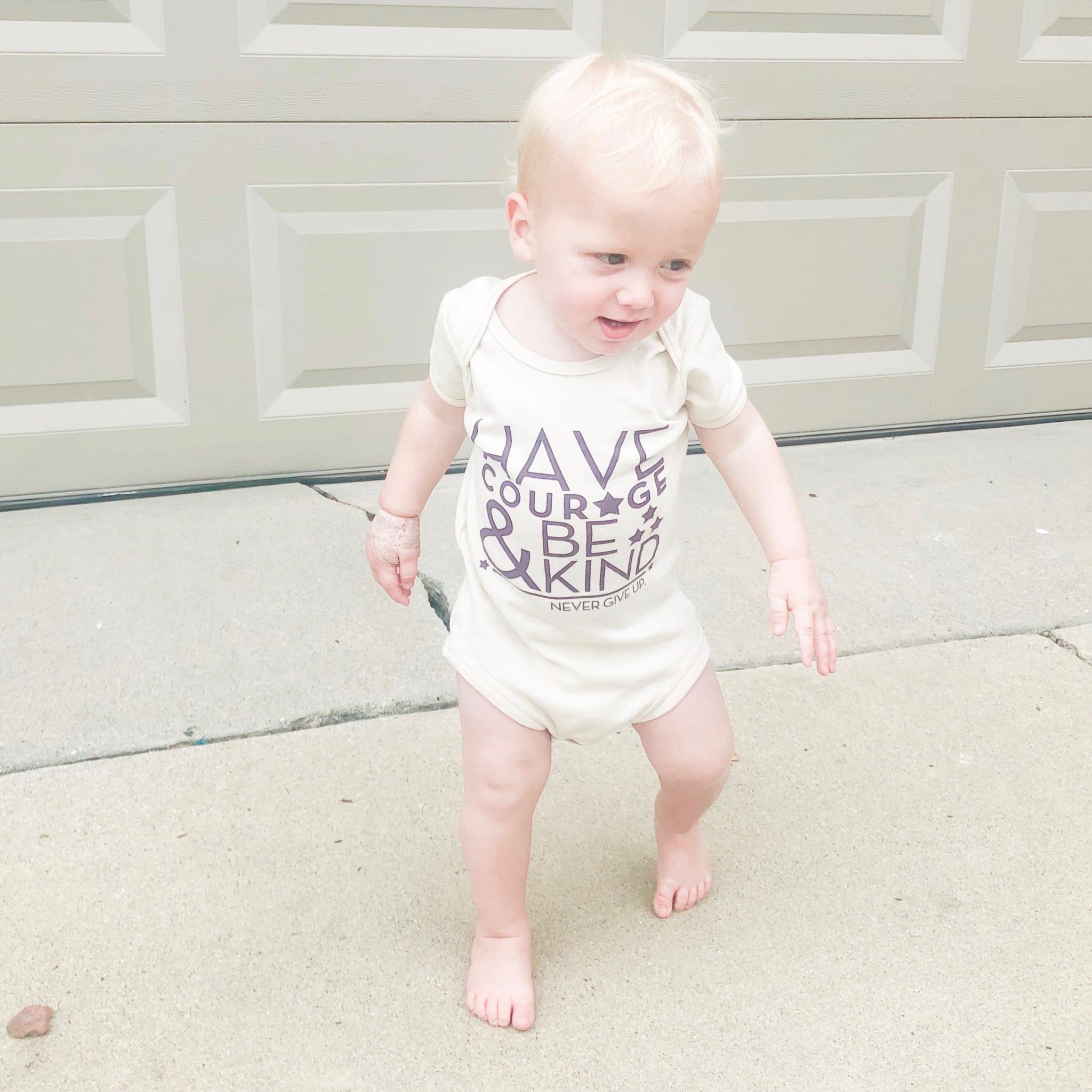 HAVE COURAGE & BE KIND ONESIE
