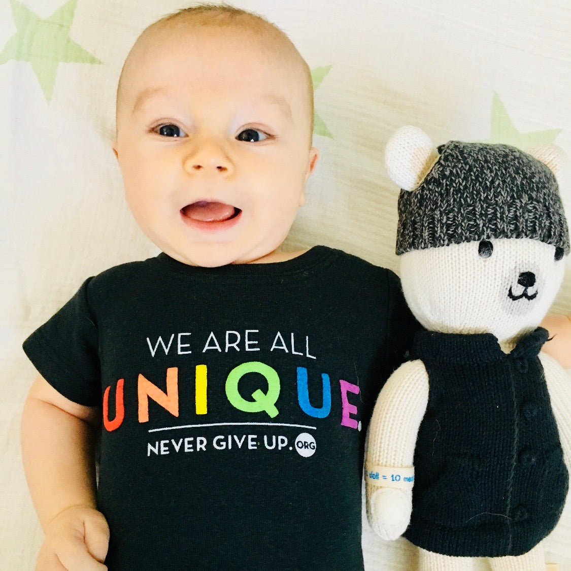 BABY WE ARE ALL UNIQUE ONESIE