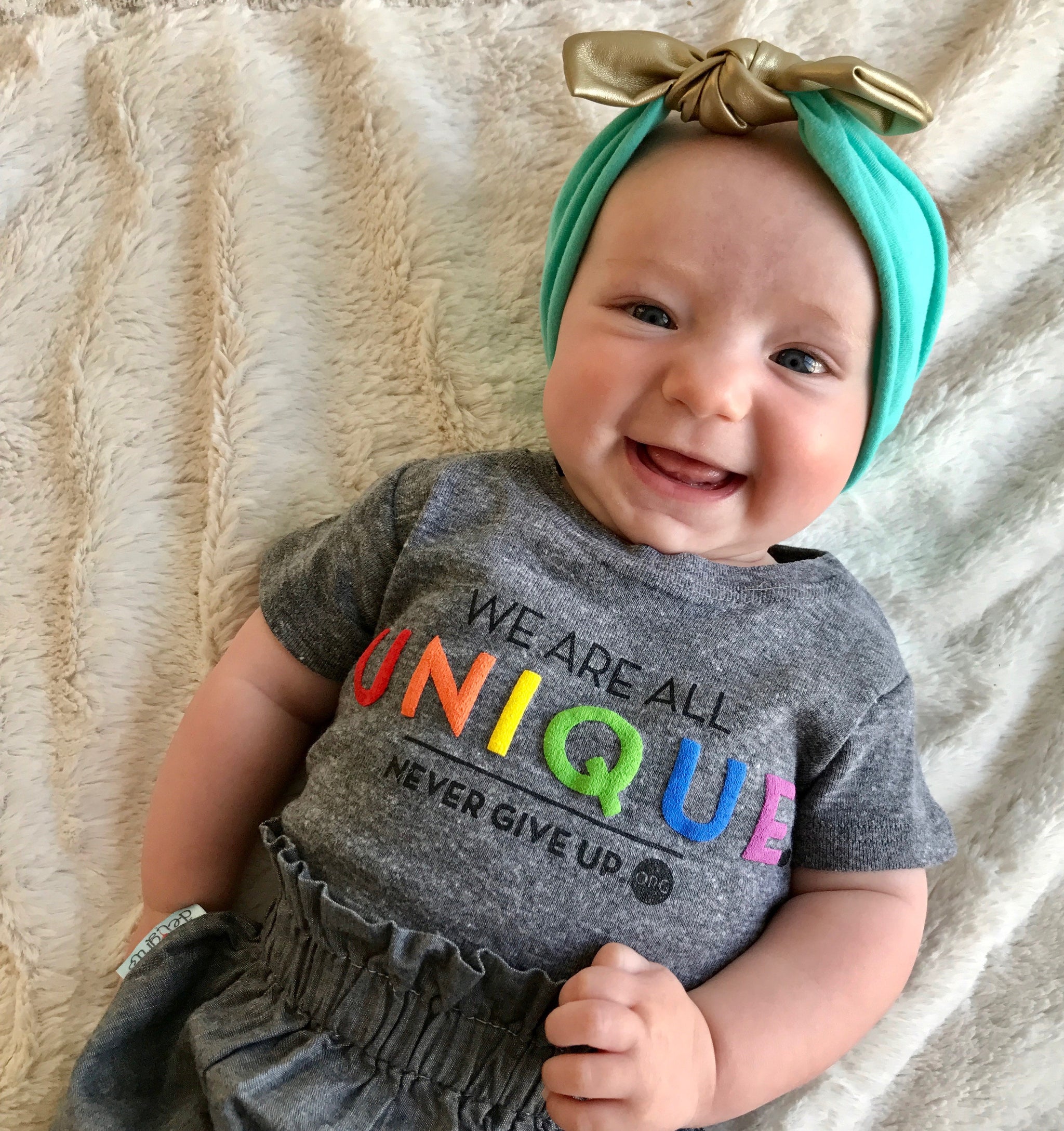 BABY WE ARE ALL UNIQUE ONESIE