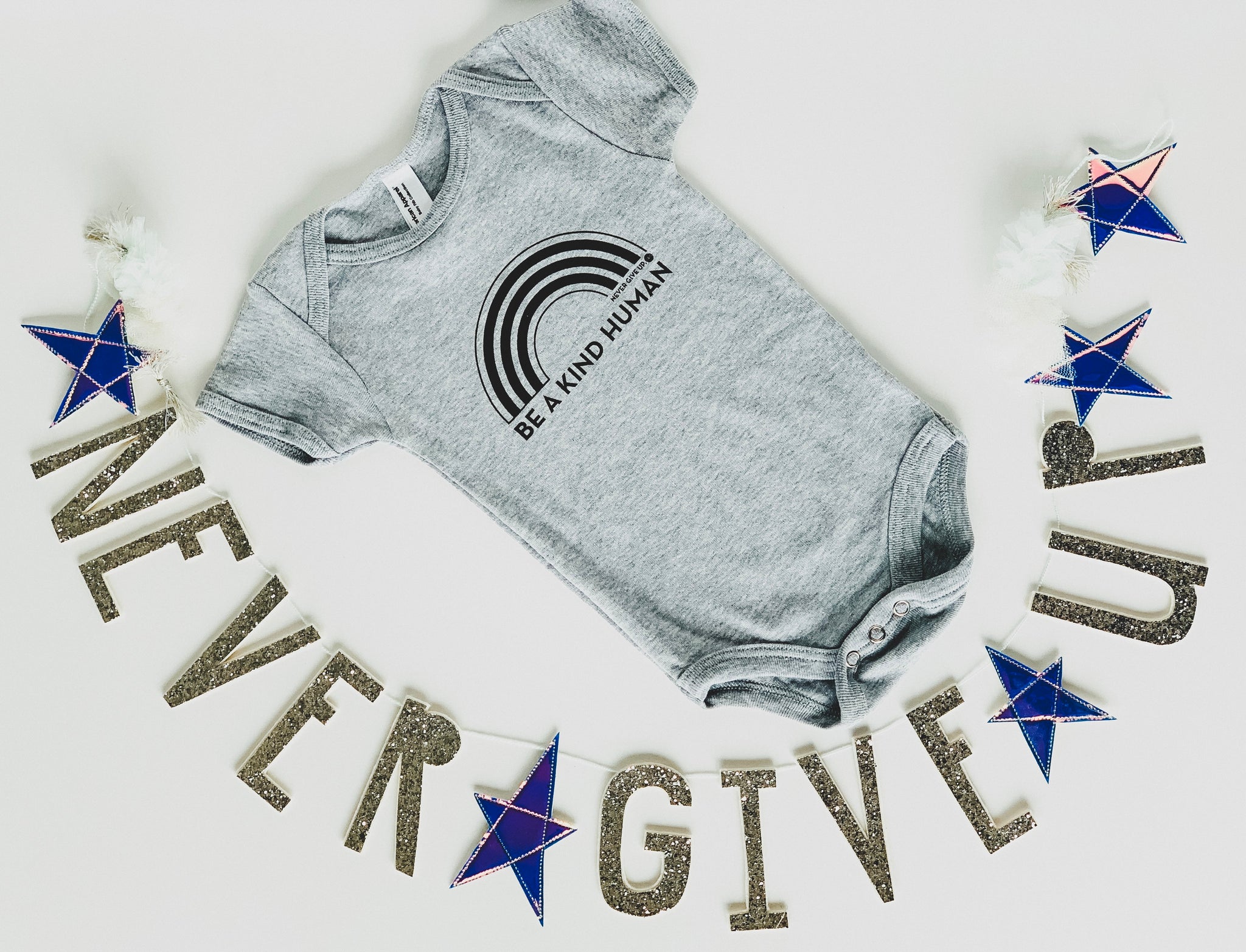 BE A KIND HUMAN BABY ONESIE