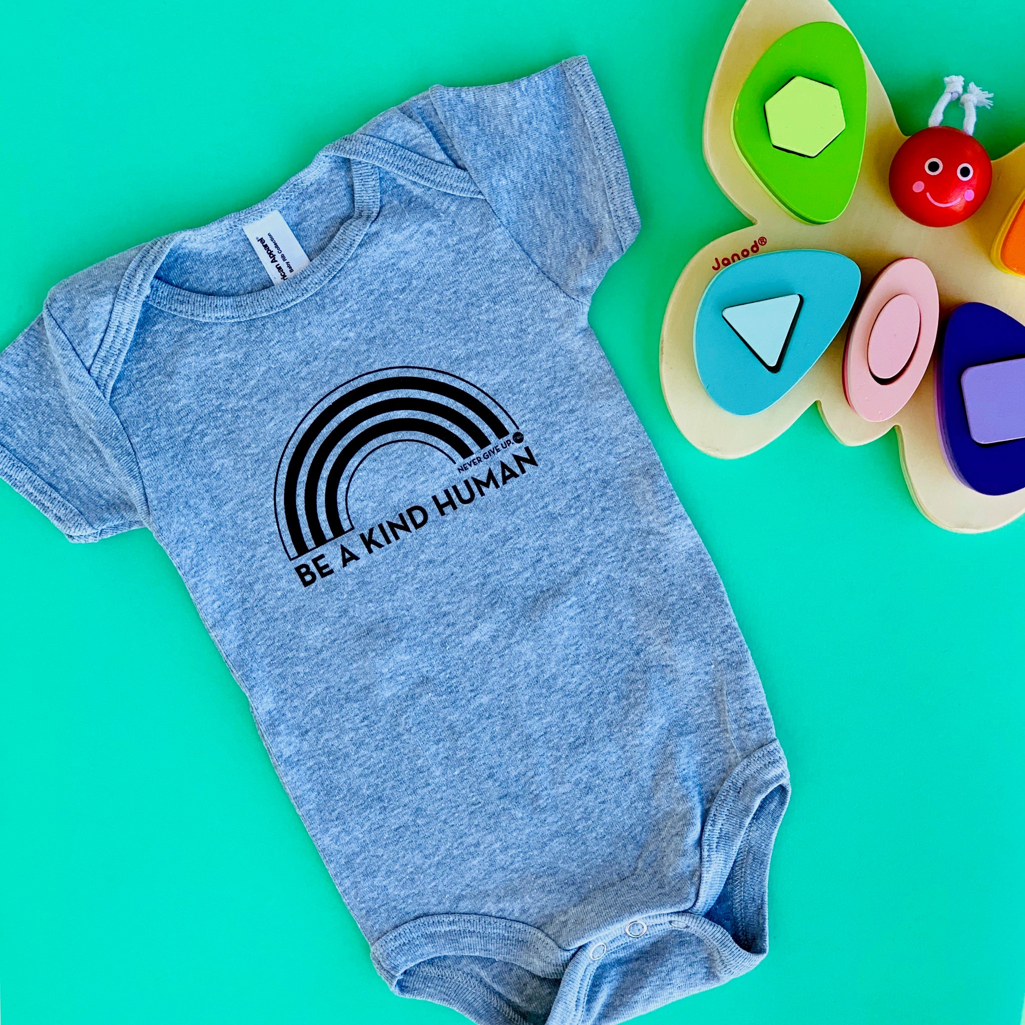 BE A KIND HUMAN BABY ONESIE