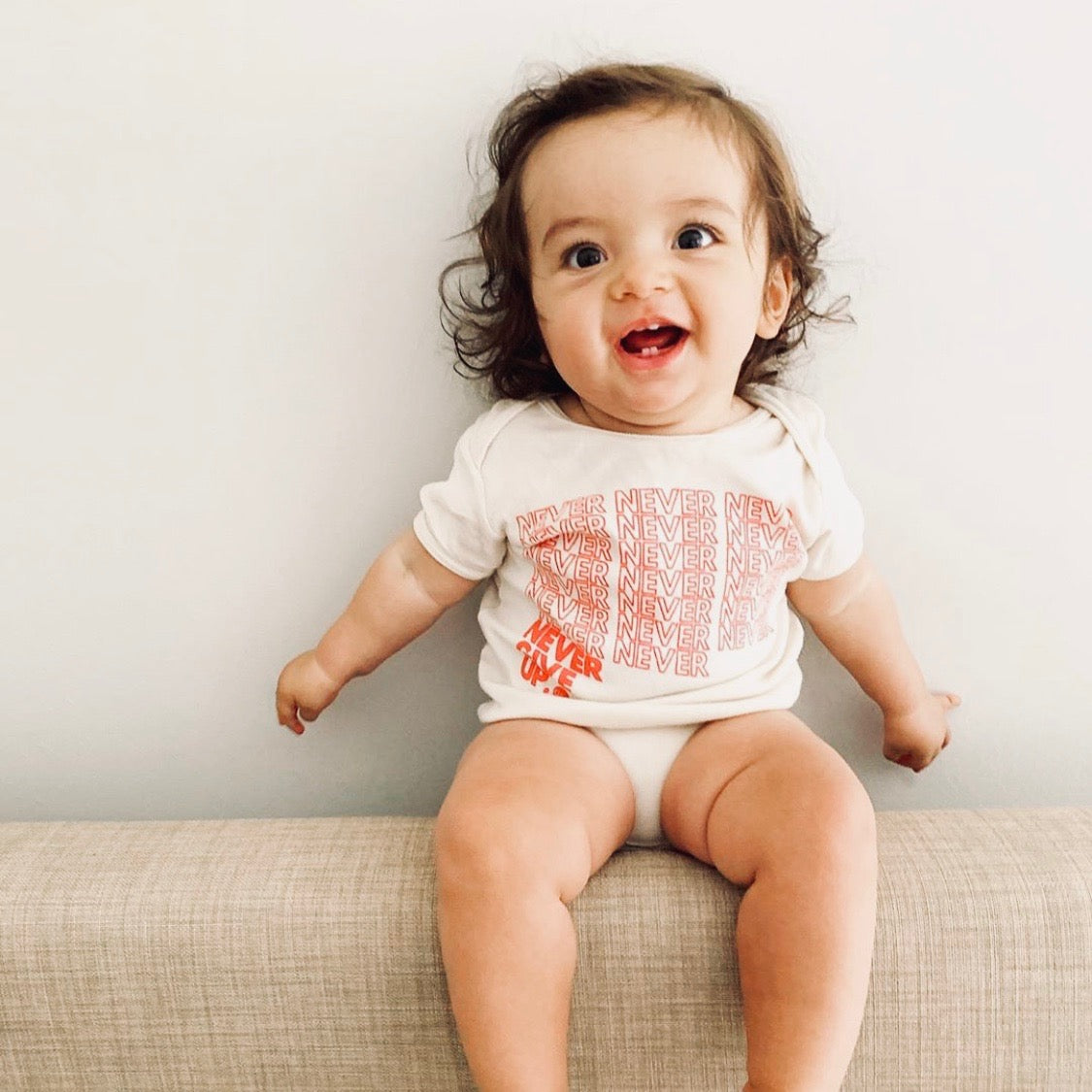 BABY INFINITE NEVER GIVE UP. ONESIE