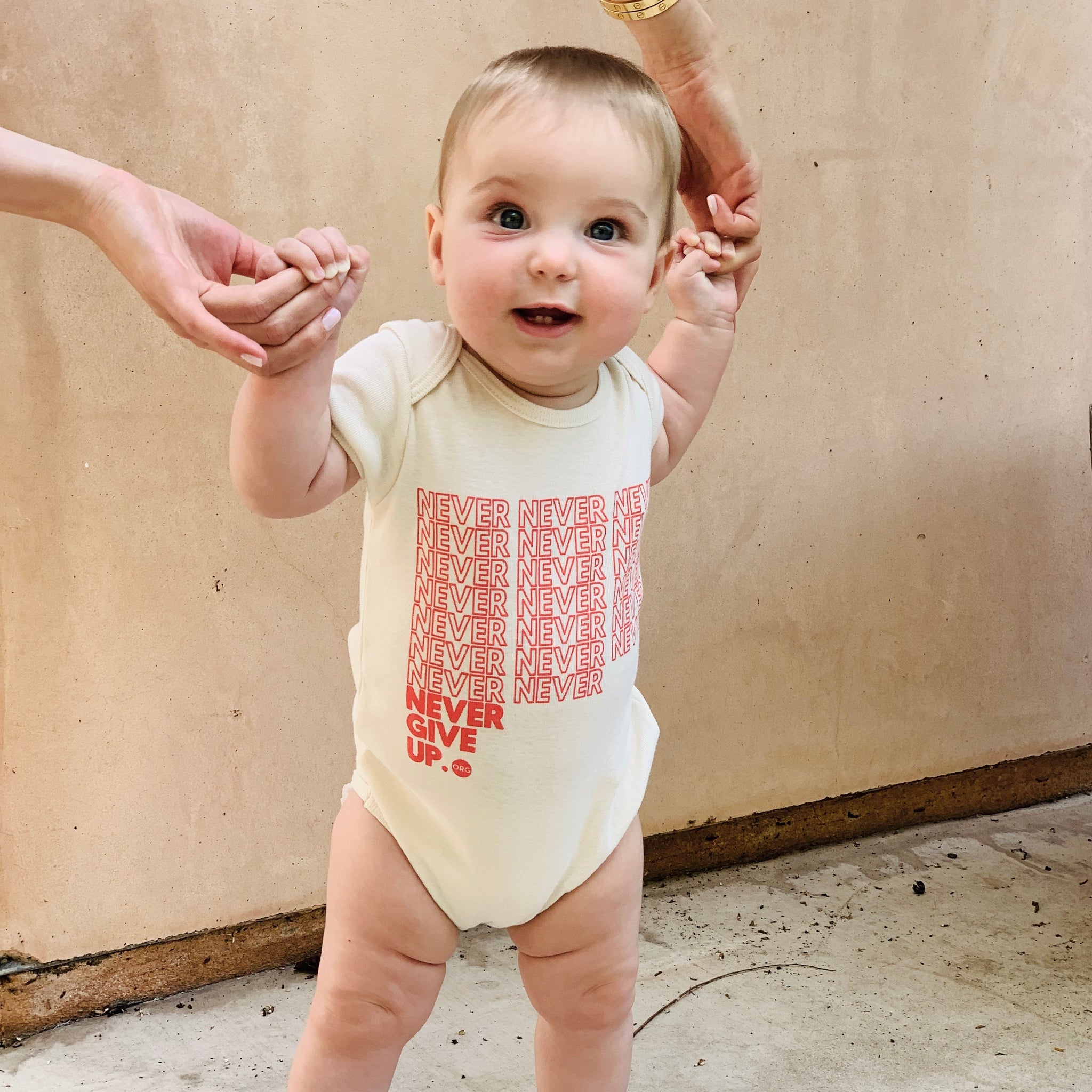 BABY INFINITE NEVER GIVE UP. ONESIE