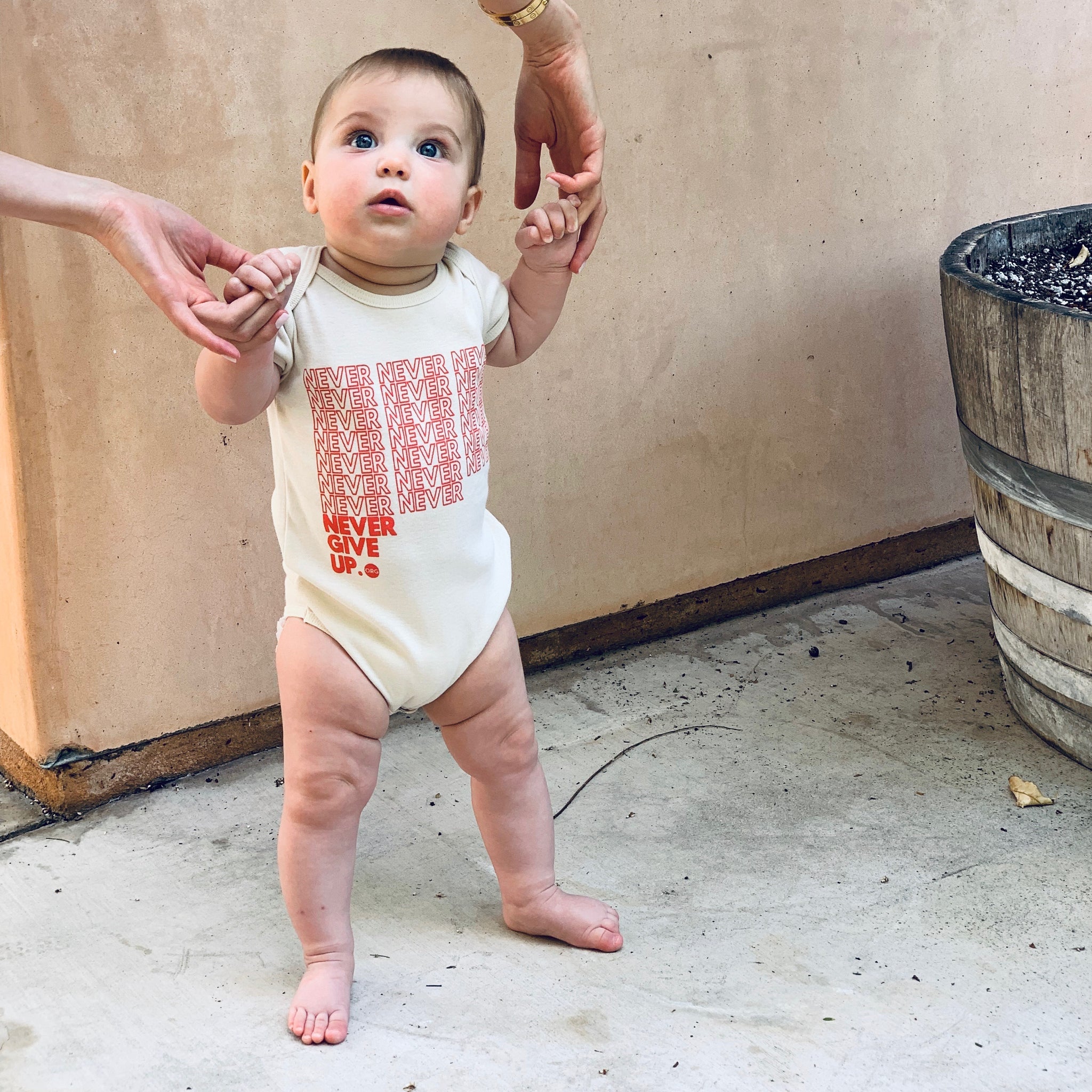 BABY INFINITE NEVER GIVE UP. ONESIE