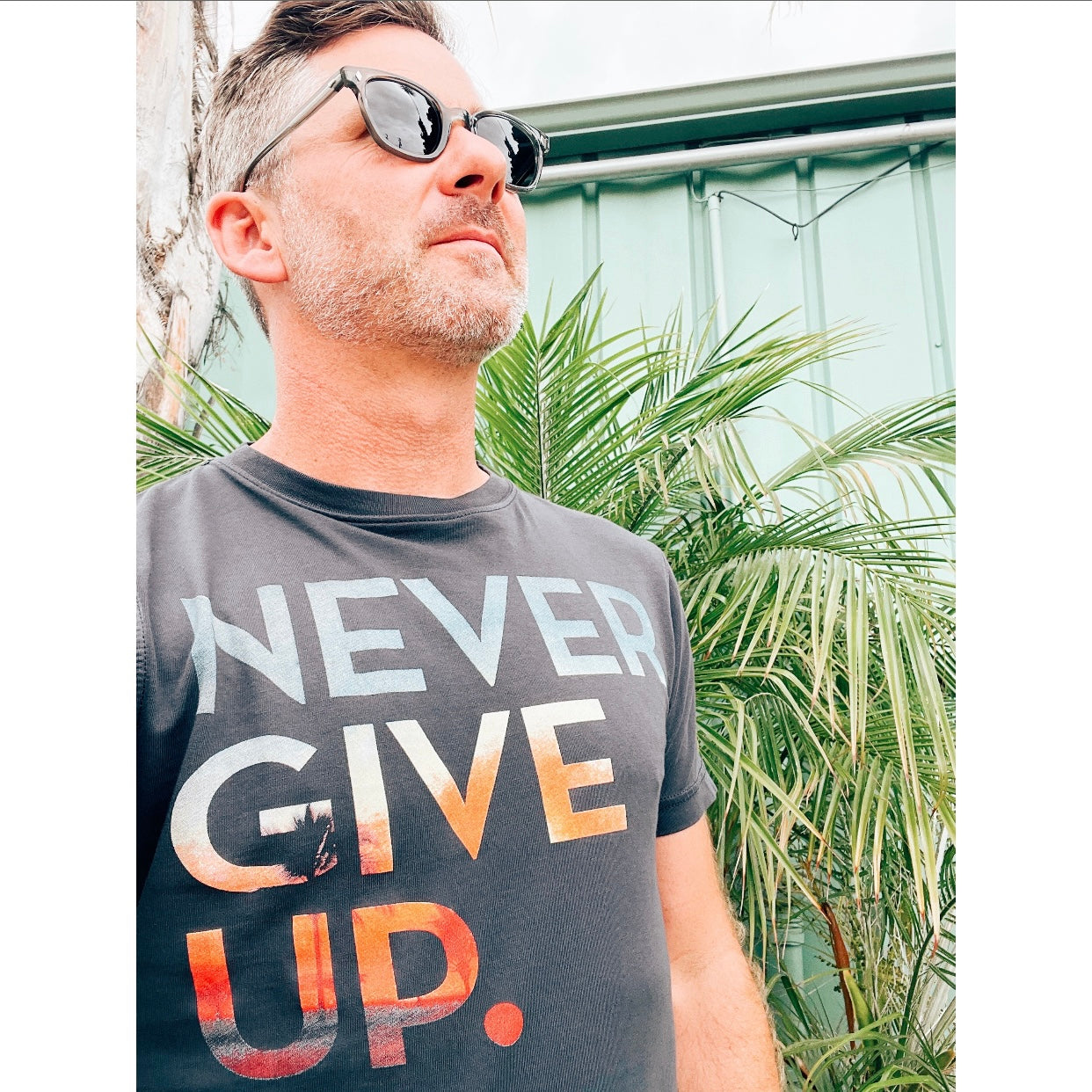 SUNSET NEVER GIVE UP. TEE