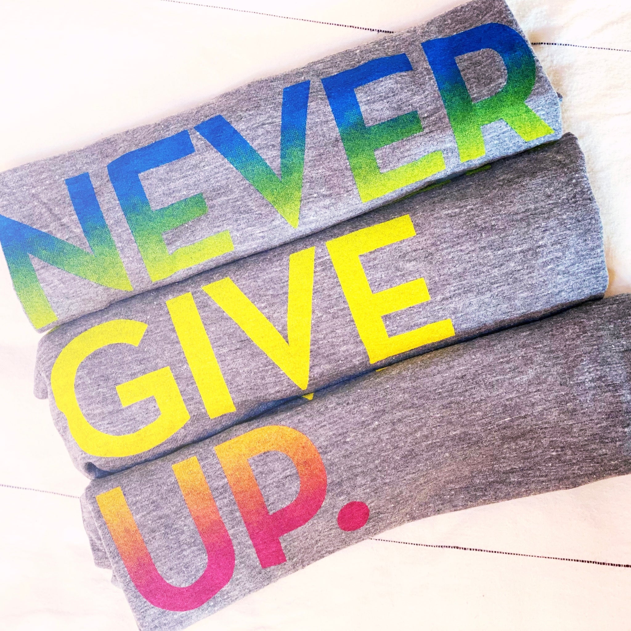 NEON RAINBOW NEVER GIVE UP. Tee