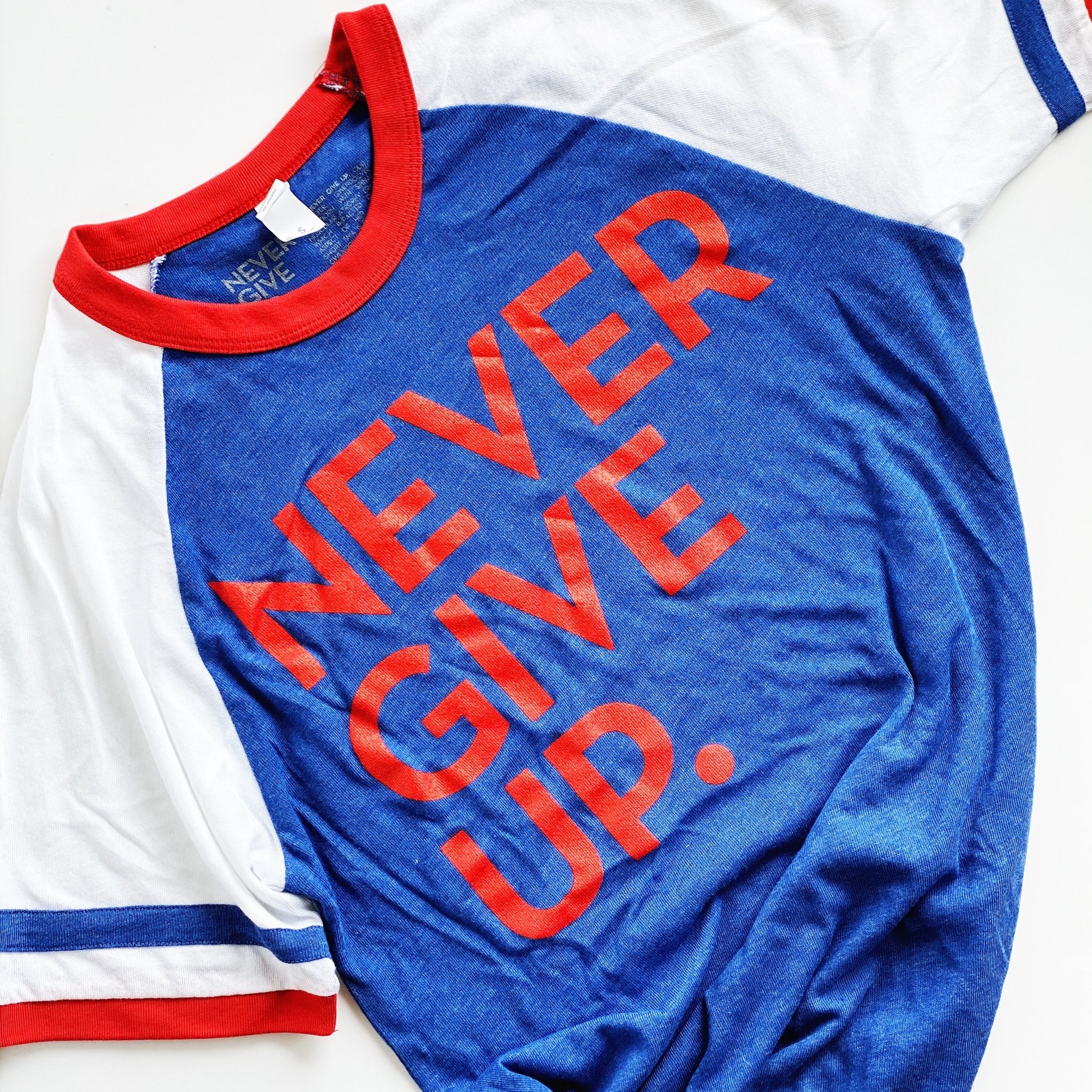 UNISEX RED, WHITE & BLUE NEVER GIVE UP.