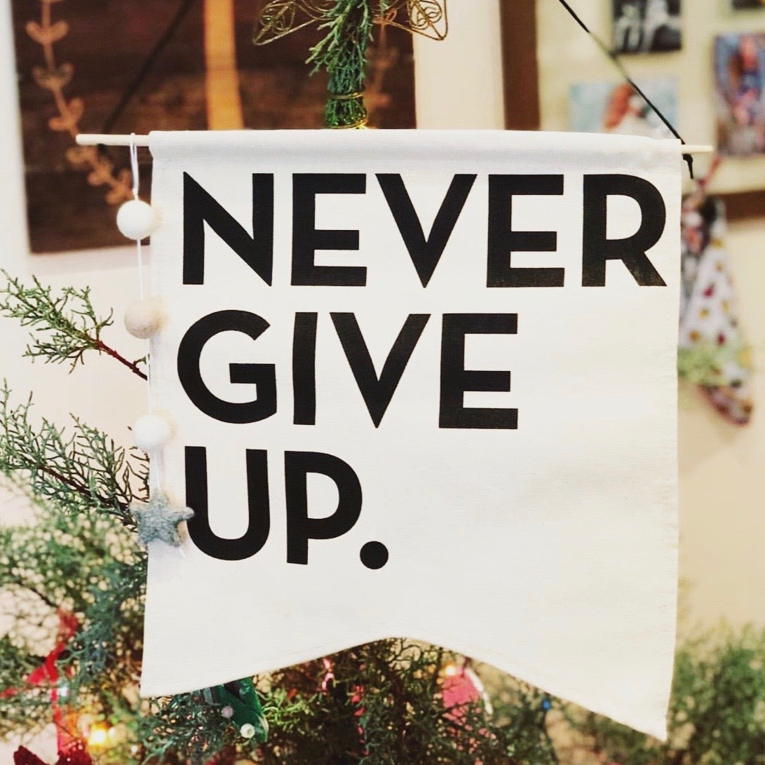 NEVER GIVE UP. CANVAS BANNER