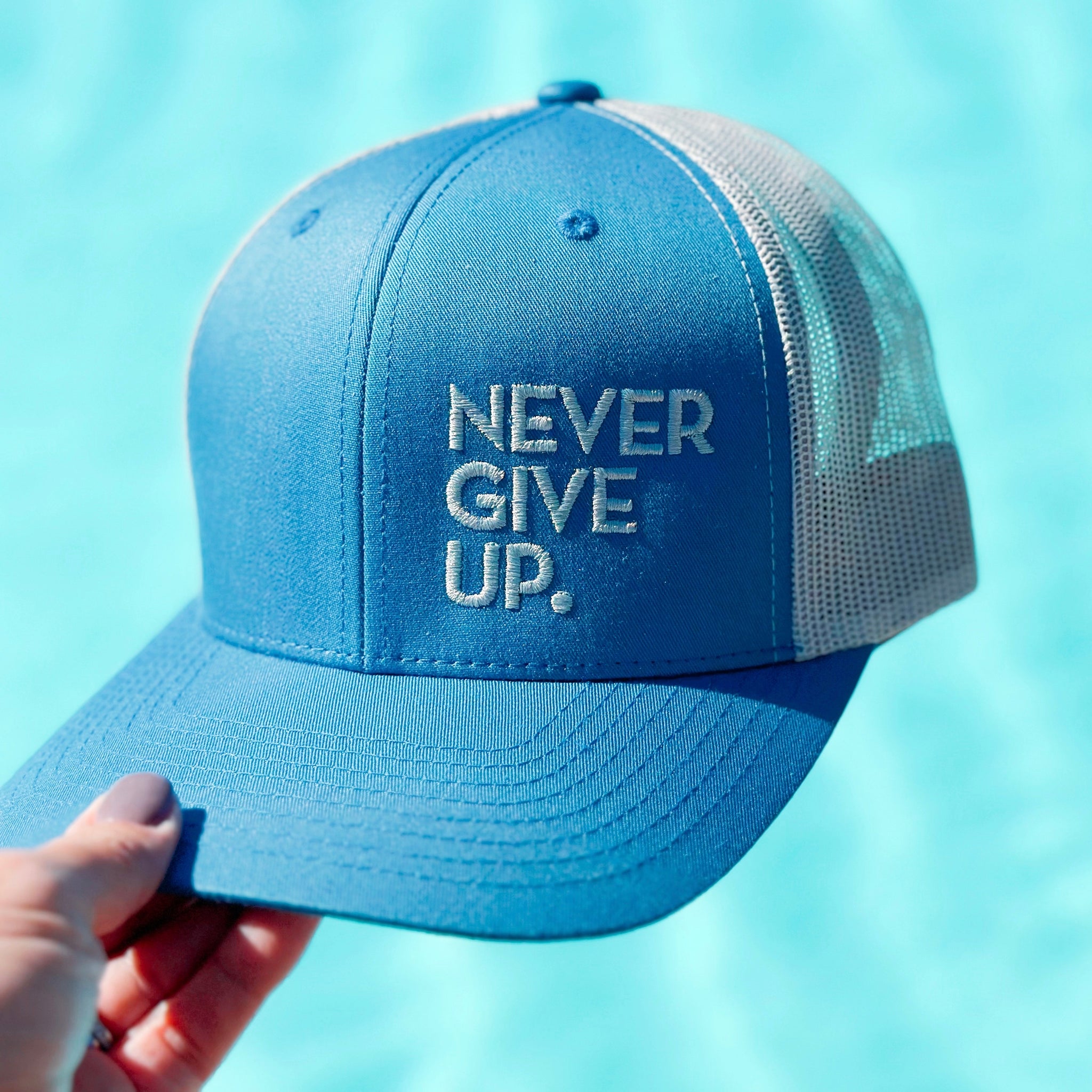 NEVER GIVE UP. HAT (BLUE/SILVER)