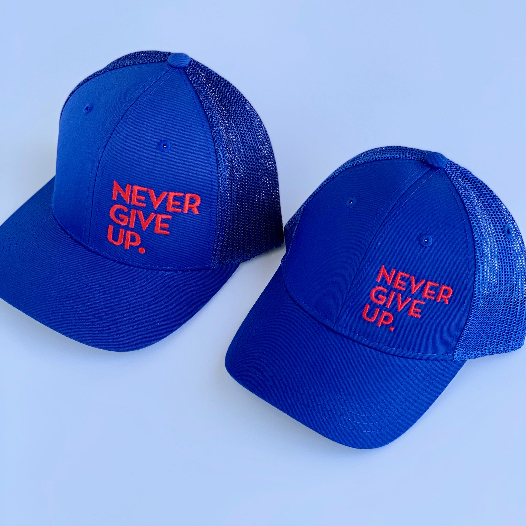 NEVER GIVE UP. HAT (BLUE/RED)